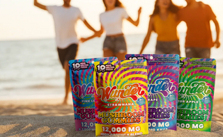 Colorful packages of 'Wunder' mushroom gummies on a beach with people in the background.